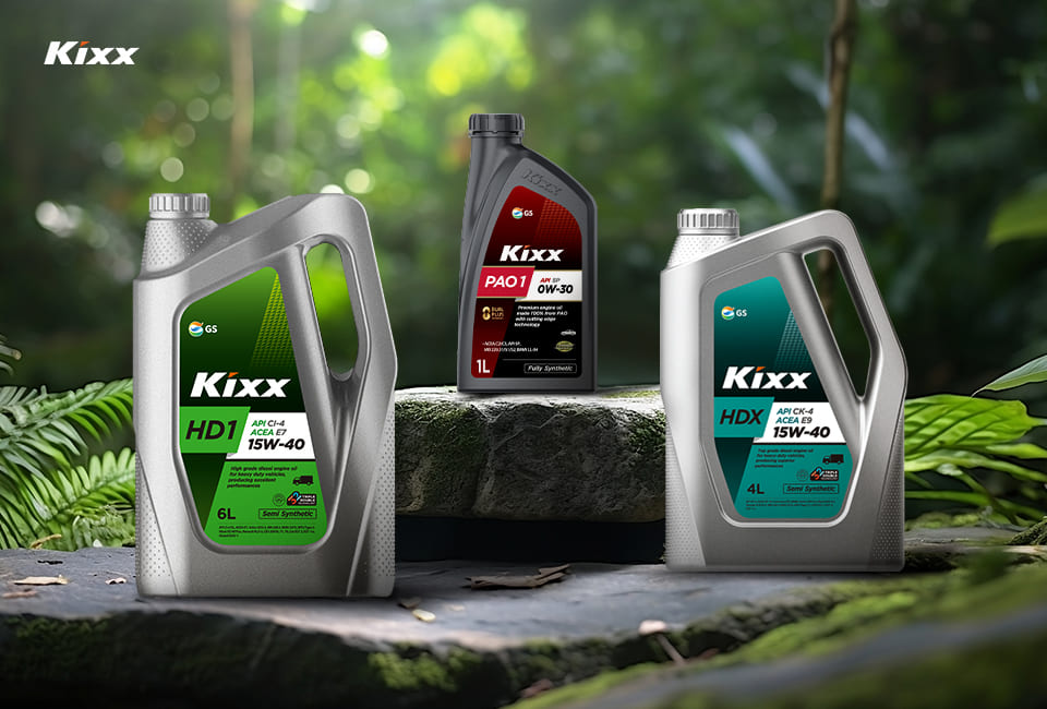 Three variations of Kixx container stand on a mossy rock against a forest backdrop.