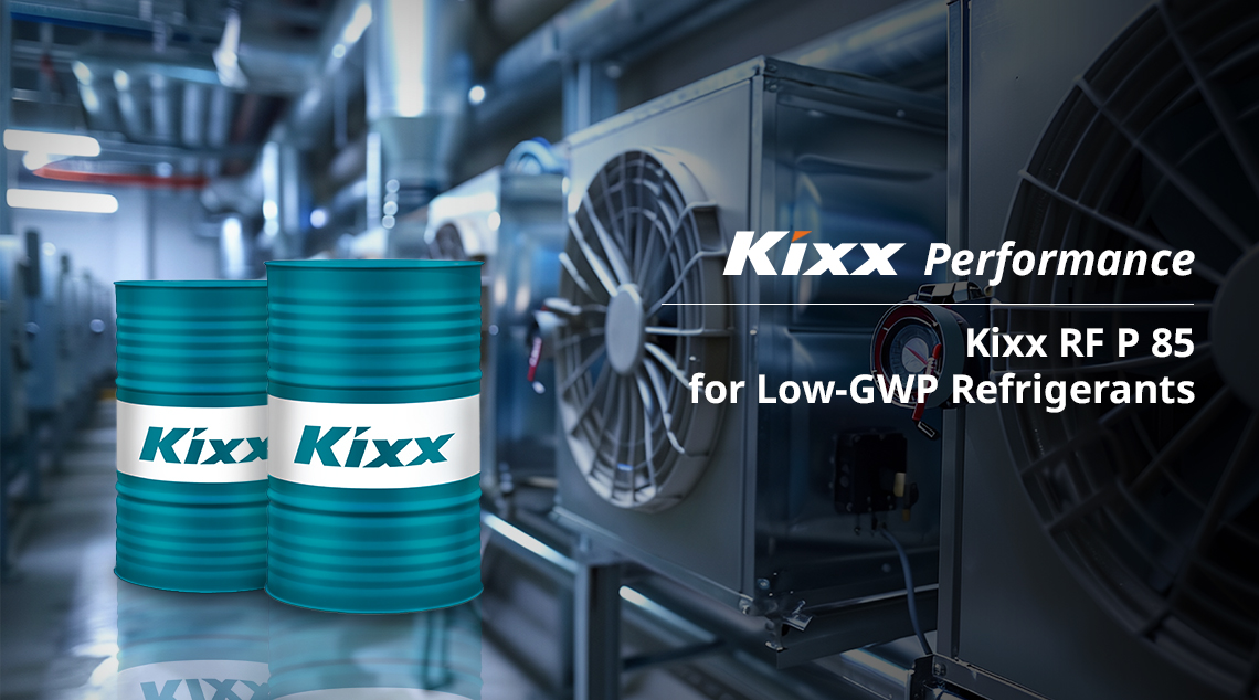 Two Kixx RF P 85 oil drums positioned on a rooftop near an industrial refrigeration unit, promoting Kixx RF P 85 as a lubricant for low-GWP refrigerants