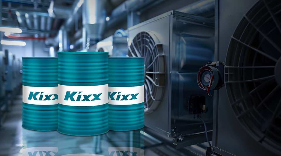 Two Kixx RF P 85 oil drums positioned on a rooftop near an industrial refrigeration unit, promoting Kixx RF P 85 as a lubricant for low-GWP refrigerants