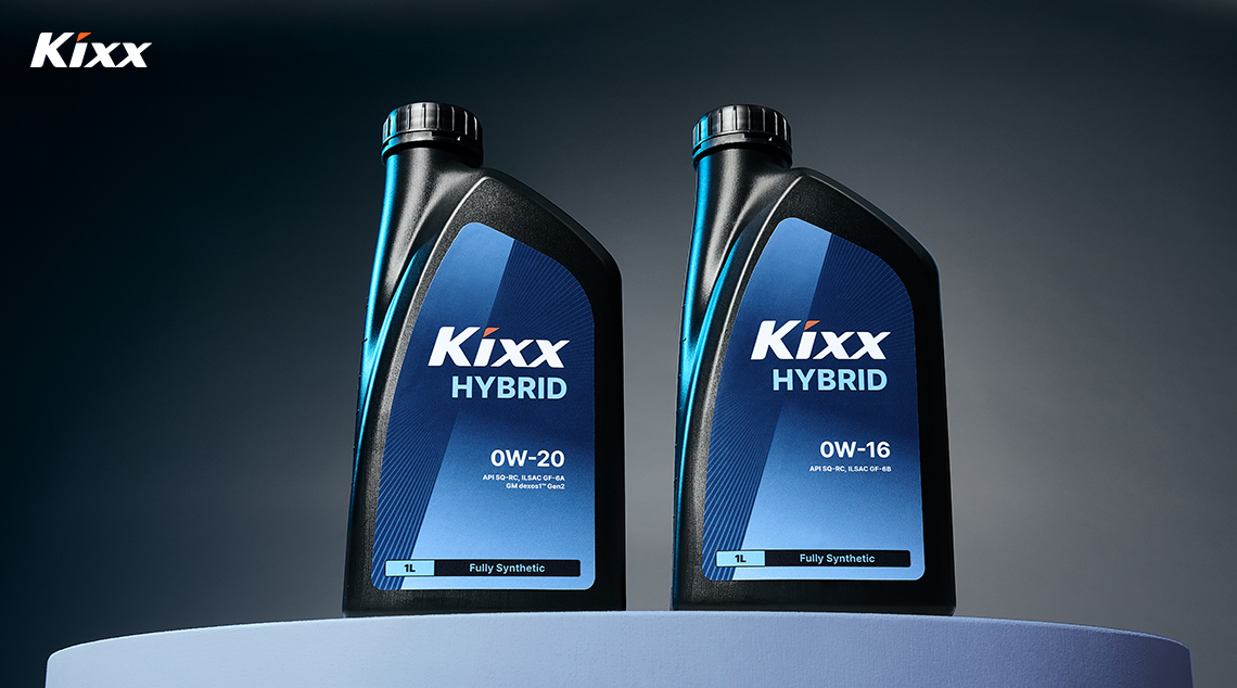 Image 3 | Kixx Newsroom Two bottles of Kixx HYBRID sit atop a blue podium against a dark backdrop.